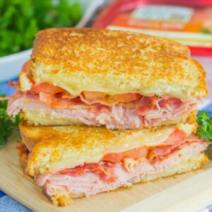 Thinly sliced honey ham, swiss cheese, fresh tomatoes, and crispy bacon are packed between fresh slices of bread that are grilled to perfection. With just six ingredients and hardly any prep work, you can have this Grilled Ham and Swiss Sandwich ready to be devoured in no time!