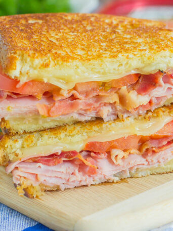 Thinly sliced honey ham, swiss cheese, fresh tomatoes, and crispy bacon are packed between fresh slices of bread that are grilled to perfection. With just six ingredients and hardly any prep work, you can have this Grilled Ham and Swiss Sandwich ready to be devoured in no time!