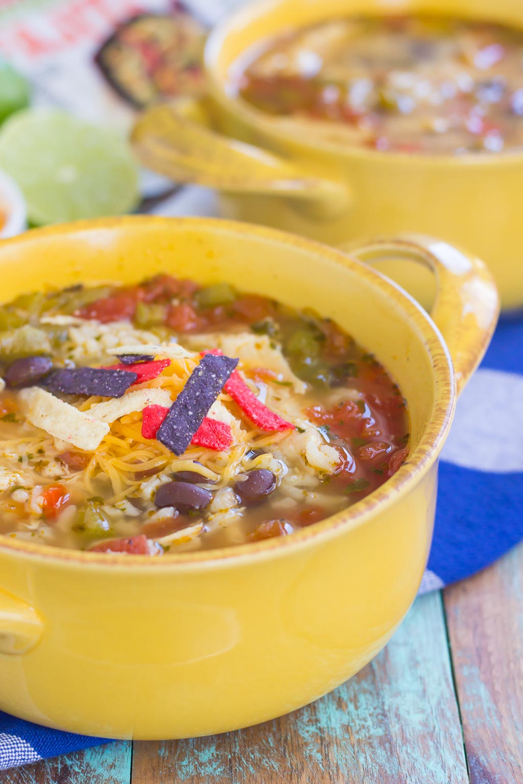 two bowls of southwest chicken soup, viewed from the side