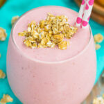This Peanut Butter and Jelly Granola Smoothie is thick, creamy, and packed with a classic peanut butter and jelly taste, in drink form. Filled with frozen strawberries, vanilla Greek yogurt, creamy peanut butter, and crunchy granola, this smoothie is ready just minutes and is perfect to serve for just about any meal!