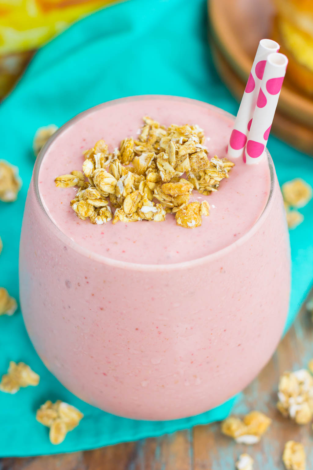 This Peanut Butter and Jelly Granola Smoothie is thick, creamy, and packed with a classic peanut butter and jelly taste, in drink form. Filled with frozen strawberries, vanilla Greek yogurt, creamy peanut butter, and crunchy granola, this smoothie is ready just minutes and is perfect to serve for just about any meal!