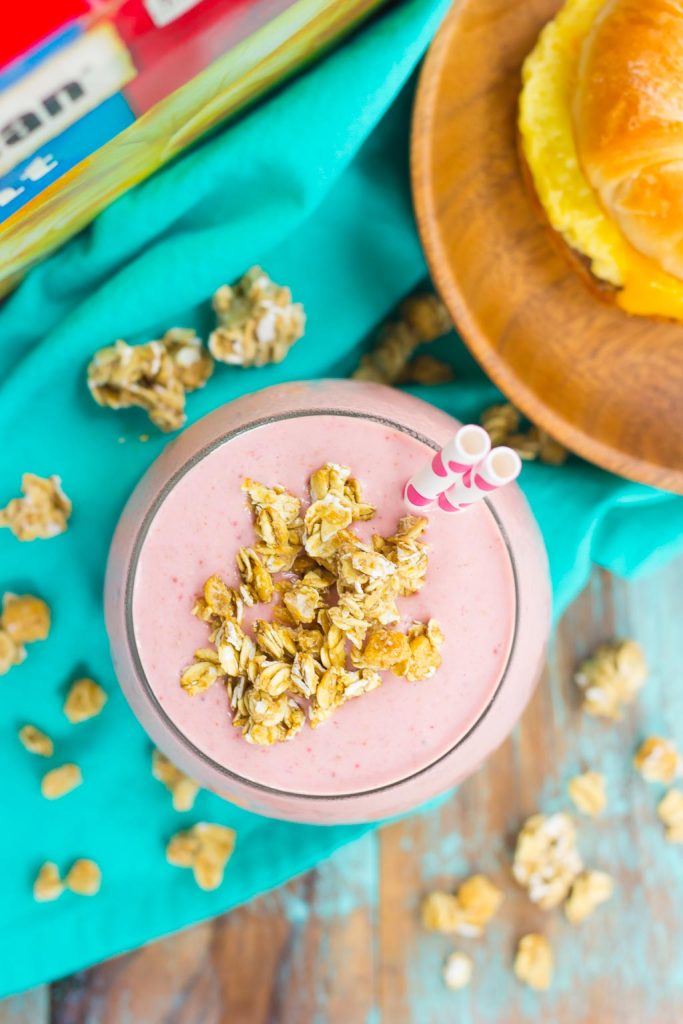 This Peanut Butter and Jelly Granola Smoothie is thick, creamy, and packed with a classic peanut butter and jelly taste, in drink form. Filled with frozen strawberries, vanilla Greek yogurt, creamy peanut butter, and crunchy granola, this smoothie is ready just minutes and is perfect to serve for just about any meal!