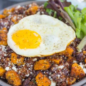 This Roasted Parmesan Sweet Potato Quinoa Bowl is a deliciously simple dish that is perfect for a light lunch or dinner. Filled with roasted sweet potatoes, hearty quinoa, black beans, feta cheese, and a fried egg, this bowl is jam-packed with flavor and so easy to make!