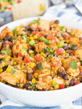 These Southwest Chicken and Rice bowls are packed with flavor and perfect for weeknight meals. Filled with tender chicken, brown rice, bell peppers, corn, black beans, and a mixture of spices, this zesty dish is simple to prepare and ready in no time!