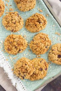 top down shot of chewy oatmeal cranberry cookies on a towel