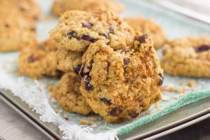  a pile of oatmeal cranberry chocolate chip cookies on a towel