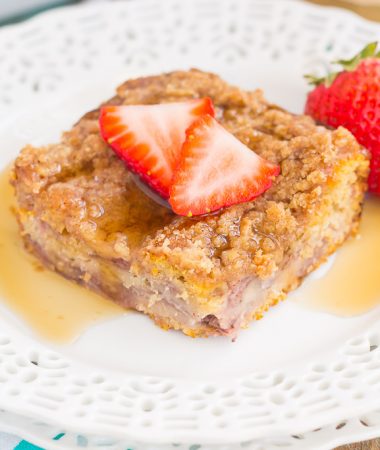 This Strawberry Cinnamon Pancake Casserole is a dish that the whole family will enjoy. Fluffy pancakes are studded with juicy strawberries, a cinnamon spread, and then back until golden. Topped sweet streusel and maple syrup, this dish is a wholesome, feel-good meal!