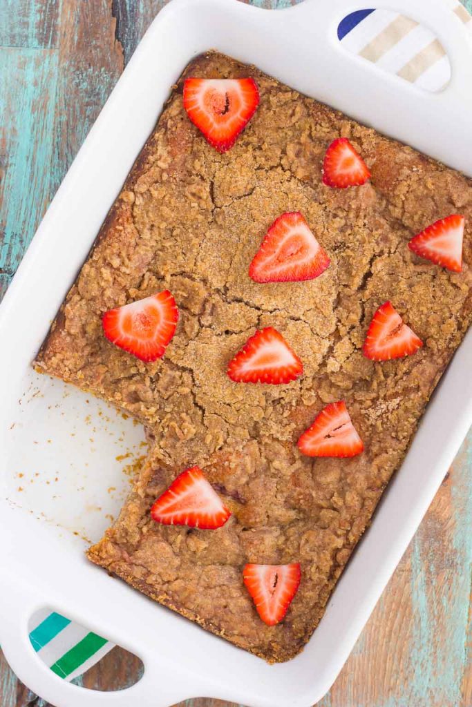 This Strawberry Cinnamon Pancake Casserole is a dish that the whole family will enjoy. Fluffy pancakes are studded with juicy strawberries, a cinnamon spread, and then baked until golden. Topped sweet streusel and maple syrup, this dish is a wholesome, feel-good meal!