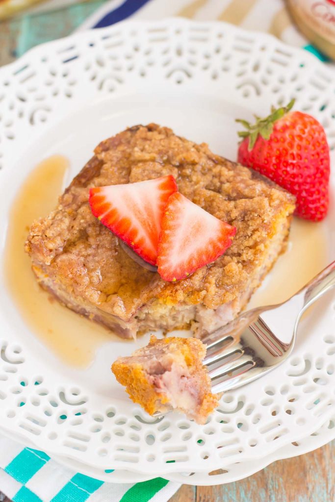 This Strawberry Cinnamon Pancake Casserole is a dish that the whole family will enjoy. Fluffy pancakes are studded with juicy strawberries, a cinnamon spread, and then baked until golden. Topped sweet streusel and maple syrup, this dish is a wholesome, feel-good meal!