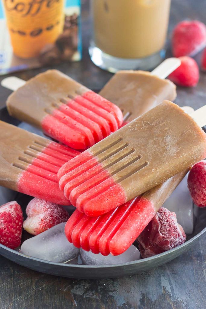 These Strawberry Mocha Pops are filled with mocha iced coffee and topped with a sweet strawberry layer. With just a few ingredients and hardly any prep work, this is the perfect treat to satisfy you sweet tooth!