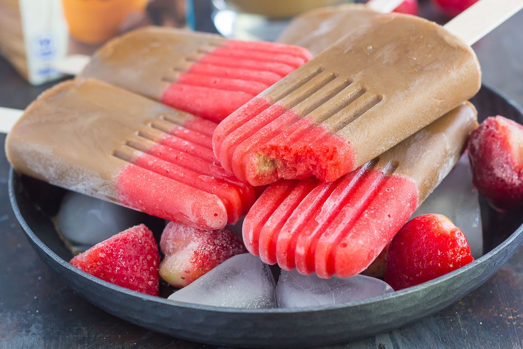 These Strawberry Mocha Pops are filled with mocha iced coffee and topped with a sweet strawberry layer. With just a few ingredients and hardly any prep work, this is the perfect treat to satisfy you sweet tooth!