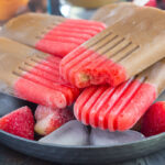 These Strawberry Mocha Pops are filled with mocha iced coffee and topped with a sweet strawberry layer. With just a few ingredients and hardly any prep work, this is the perfect treat to satisfy you sweet tooth!