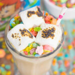 This Toasted Marshmallow Fruity Pebble Milkshake is loaded with creamy vanilla ice cream, a swirl of cereal, and topped with toasted marshmallows. With just four ingredients and hardly any prep time, you can indulge in this delicious frozen treat to beat the summer heat!