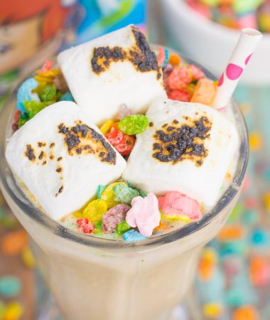 This Toasted Marshmallow Fruity Pebble Milkshake is loaded with creamy vanilla ice cream, a swirl of cereal, and topped with toasted marshmallows. With just four ingredients and hardly any prep time, you can indulge in this delicious frozen treat to beat the summer heat!