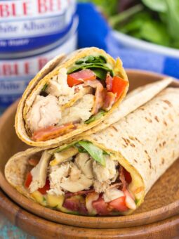 This Tuna Spinach Wrap is filled with hearty tuna, fresh spinach, crisp bacon, and tomatoes. Simple, fresh and easy to make, this dish comes together in minutes and serves as a perfect lunch or dinner for back-to-school times!