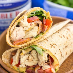 This Tuna Spinach Wrap is filled with hearty tuna, fresh spinach, crisp bacon, and tomatoes. Simple, fresh and easy to make, this dish comes together in minutes and serves as a perfect lunch or dinner for back-to-school times!