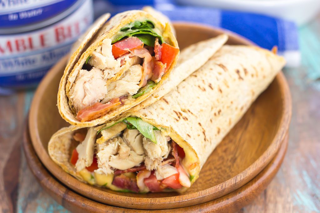 This Tuna Spinach Wrap is filled with hearty tuna, fresh spinach, crisp bacon, and tomatoes. Simple, fresh and easy to make, this dish comes together in minutes and serves as a perfect lunch or dinner for back-to-school times!
