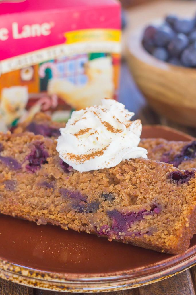 This Blueberry Gingerbread Loaf is soft, moist, and loaded with fresh blueberries and cozy spices. Easy to make and bursting with the flavors of the season, this bread makes a delicious breakfast or dessert for your hungry house guests! #gingerbread #gingerbreadloaf #gingerbreadrecipe #christmasrecipe #holidaydessert #christmasdessert #dessert