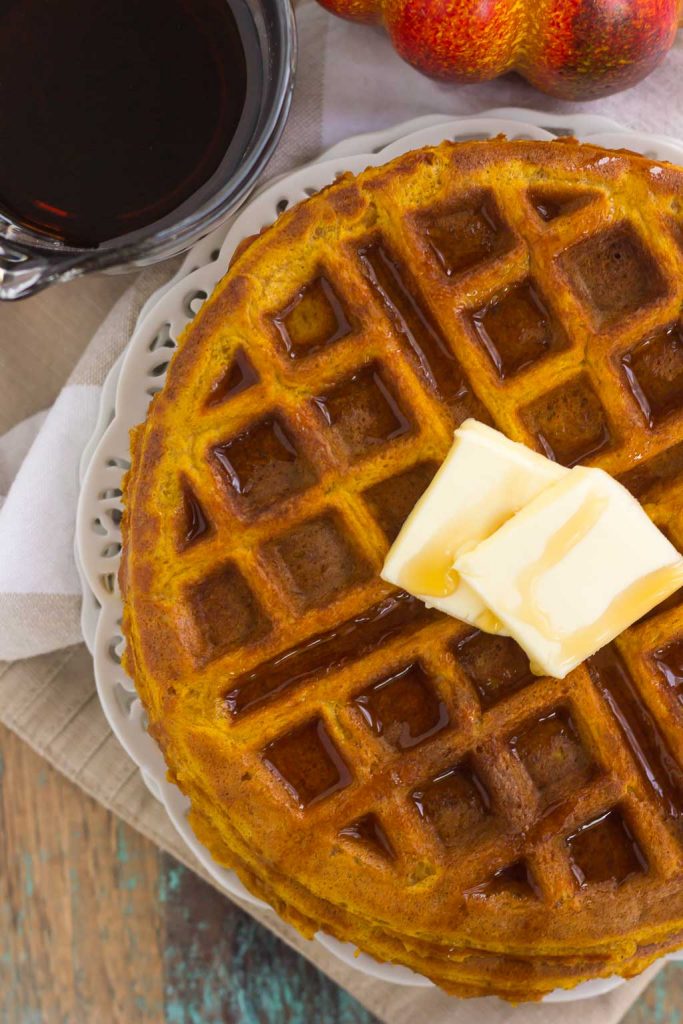 These Pumpkin Spice Waffles are crispy on the outside, tender on the inside, and filled with cozy fall flavors. You can satisfy your craving for pumpkin with this easy breakfast that's sure to be a favorite all year long!