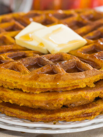 These Pumpkin Spice Waffles are crispy on the outside, tender on the inside, and filled with cozy fall flavors. You can satisfy your craving for pumpkin with this easy breakfast that's sure to be a favorite all year long!