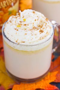 This Slow Cooker Pumpkin Caramel White Hot Chocolate is a deliciously sweet and creamy drink that's bursting with fall flavors. It's a perfect recipe to enjoy on a chilly evening and is so easy to make! Keep your crock pot on warm to impress those party guests! #pumpkin #pumpkindrink #pumpkinhotchocolate #pumpkinwhitehotchocolate #whitehotchocolate #hotchocolaterecipe #falldrink #drink #hotbeverage #hotchocolaterecipes #pumpkincaramelhotchocolate