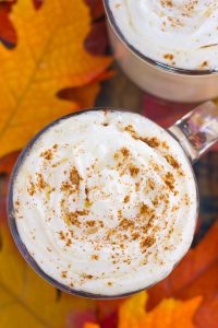 This Slow Cooker Pumpkin Caramel White Hot Chocolate is a deliciously sweet and creamy drink that's bursting with fall flavors. It's a perfect recipe to enjoy on a chilly evening and is so easy to make! Keep your crock pot on warm to impress those party guests! #pumpkin #pumpkindrink #pumpkinhotchocolate #pumpkinwhitehotchocolate #whitehotchocolate #hotchocolaterecipe #falldrink #drink #hotbeverage #hotchocolaterecipes #pumpkincaramelhotchocolate