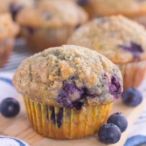 These Bakery Style Blueberry Muffins are filled with juicy blueberries that are swirled into a sweet batter and topped with a cinnamon streusel. Soft, moist, and bursting with flavor, these muffins are just as delicious as the ones that you would find at a bakery!