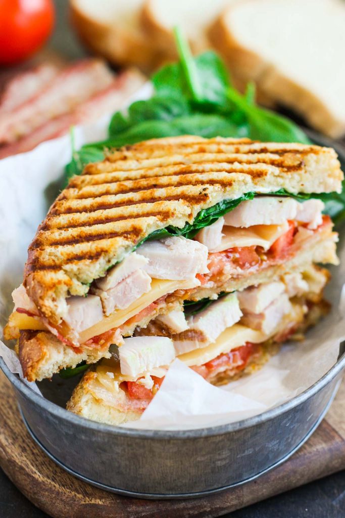 This Bacon Ranch Chicken Panini is loaded with tender chunks of chicken, crisp bacon, fresh spinach, Havarti cheese, and a garlic ranch dressing!