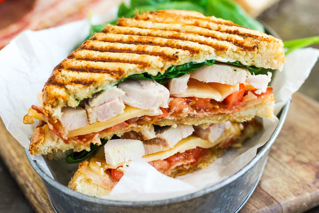 This Chicken Bacon Ranch Panini is fast, fresh, and ready in no time. Loaded with tender chunks of chicken, crisp bacon, fresh spinach, Havarti cheese, and a garlic ranch dressing, this sandwich is packed with flavor and makes the perfect, easy meal!