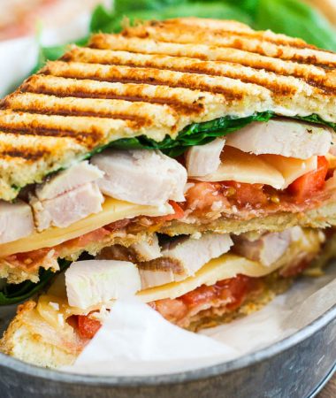 This Chicken Bacon Ranch Panini is fast, fresh, and ready in no time. Loaded with tender chunks of chicken, crisp bacon, fresh spinach, Havarti cheese, and a garlic ranch dressing, this sandwich is packed with flavor and makes the perfect, easy meal!