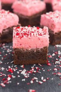 Sliced peppermint brownies garnished with crushed candy canes. 