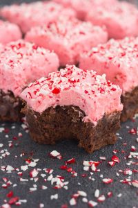 a frosted Christmas brownie with a bite taken out of it