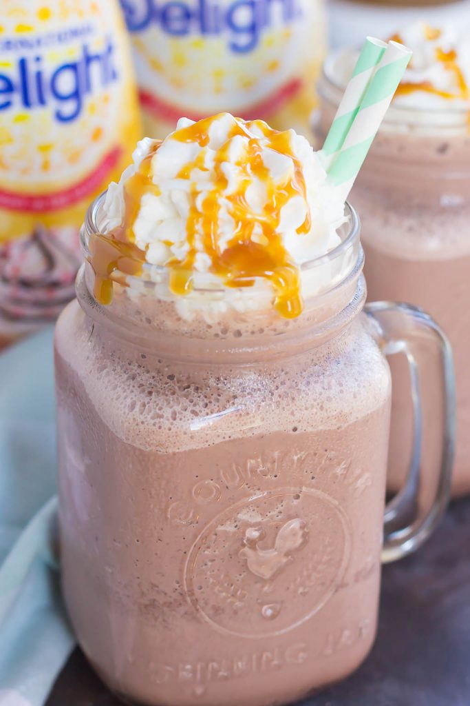 This Frozen Salted Caramel Mocha Hot Chocolate is a festive way to embrace the start of the holiday season. This easy drink is a sweet and creamy blend of hot chocolate, milk, and the rich flavors of salted caramel and mocha! #hotchocolate #frozenhotchocolate #saltedcaramel #caramelhotchocolate #drink #holidaydrink #holidaybeverage #frozendrink