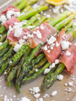 Fresh asparagus is wrapped in thin slices of prosciutto, roasted to perfection and then topped with crumbed feta cheese. Salty, crispy and packed with flavor, this Prosciutto Wrapped Asparagus with Feta makes an easy and delicious side dish!