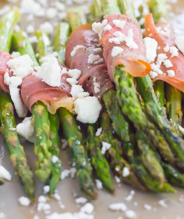 Fresh asparagus is wrapped in thin slices of prosciutto, roasted to perfection and then topped with crumbed feta cheese. Salty, crispy and packed with flavor, this Prosciutto Wrapped Asparagus with Feta makes an easy and delicious side dish!