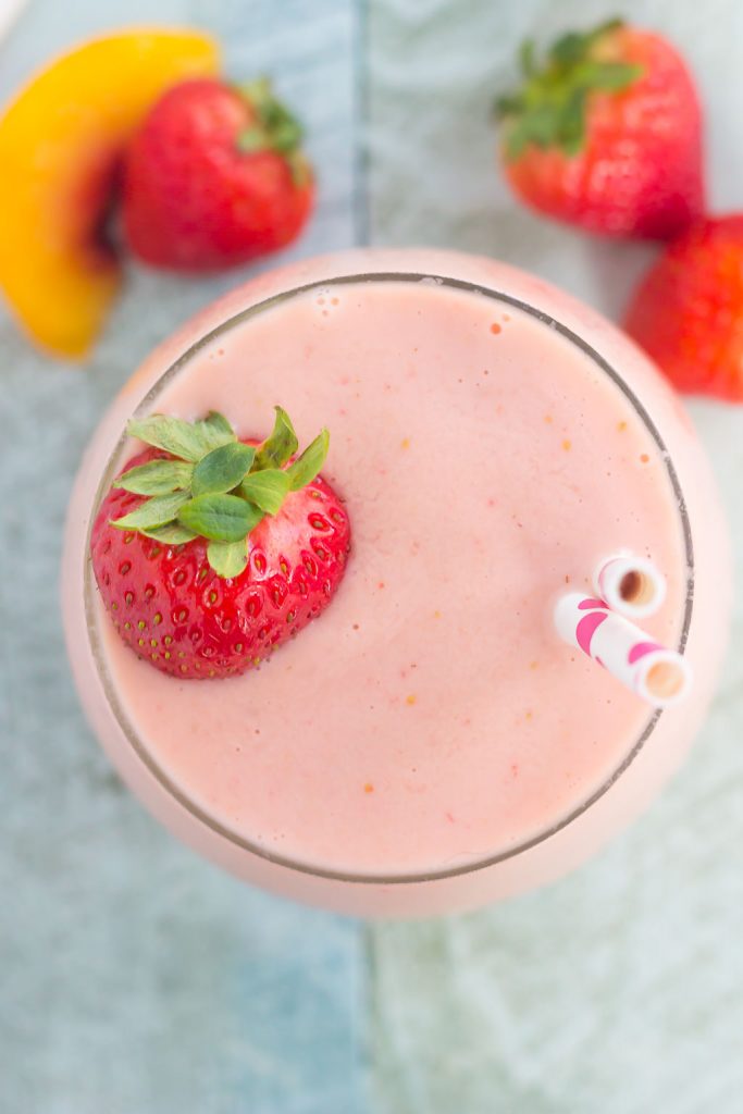 This Strawberry Peach Smoothie is thick, creamy, and packed with juicy strawberries and peaches. With just a few ingredients and hardly any prep time, this healthier breakfast or snack is perfect to satisfy your sweet tooth!