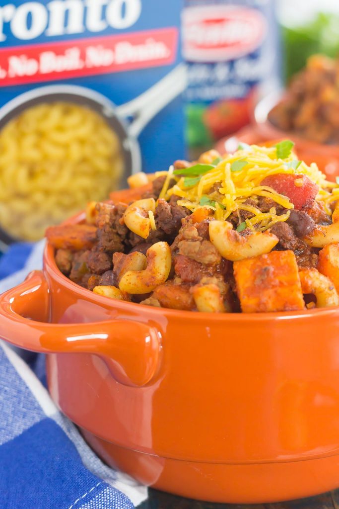 This Sweet Potato Chili Pasta is a one pot dish that's packed with the warm and comforting flavors of the season. Hearty, thick, and filled with sweet potatoes, beef, black beans, and pasta, you'll love this easy meal! #chili #chilipasta #chilirecipe #sweetpotatorecipe #sweetpotatopasta #sweetpotatochili #sweetpotatochilirecipe #dinner #falldinner #comfortfood #pasta #pastarecipeecipeThis Sweet Potato Chili Pasta is a one pot dish that's packed with the warm and comforting flavors of the season. Hearty, thick, and filled with sweet potatoes, beef, black beans, and pasta, you'll love this easy meal!