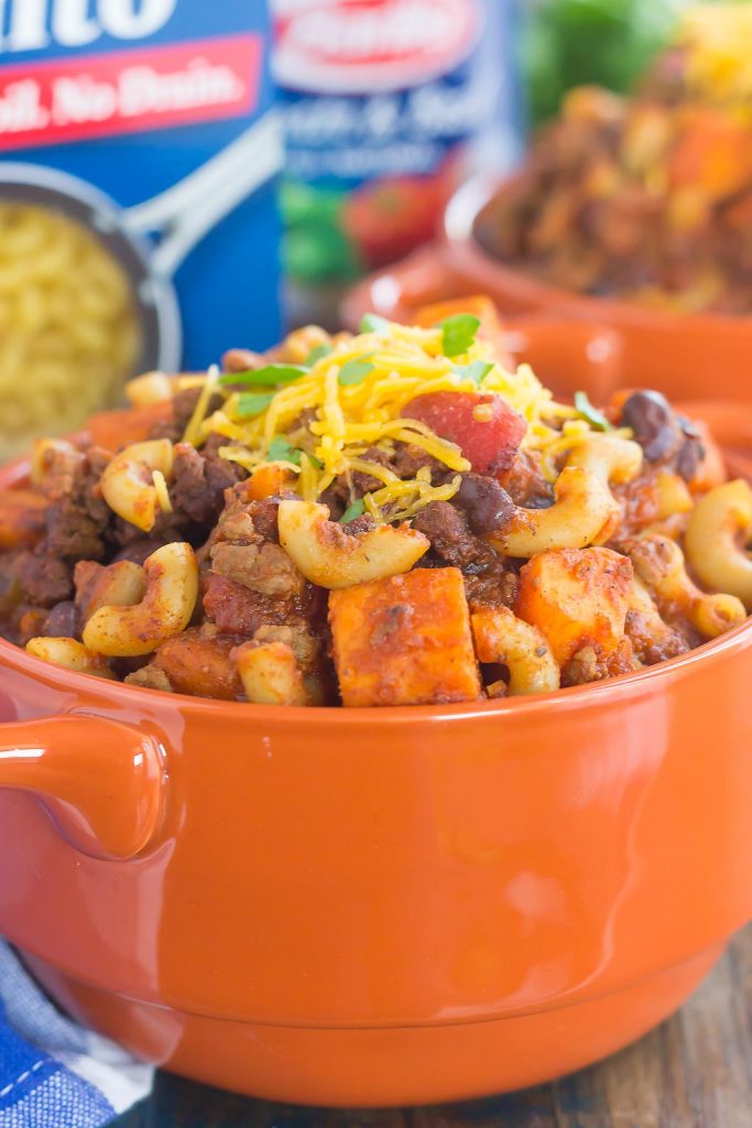 This Sweet Potato Chili Pasta is a one pot dish that's packed with the warm and comforting flavors of the season. Hearty, thick, and filled with sweet potatoes, beef, black beans, and pasta, you'll love this easy meal! #chili #chilipasta #chilirecipe #sweetpotatorecipe #sweetpotatopasta #sweetpotatochili #sweetpotatochilirecipe #dinner #falldinner #comfortfood #pasta #pastarecipe