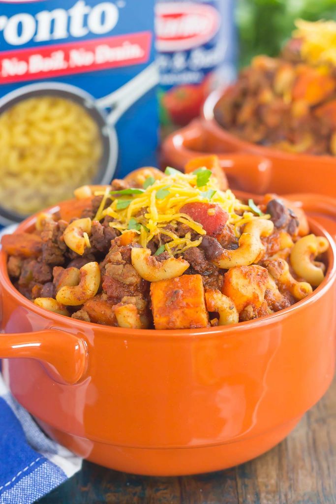 This Sweet Potato Chili Pasta is a one pot dish that's packed with the warm and comforting flavors of the season. Hearty, thick, and filled with sweet potatoes, beef, black beans, and pasta, you'll love this easy meal! #chili #chilipasta #chilirecipe #sweetpotatorecipe #sweetpotatopasta #sweetpotatochili #sweetpotatochilirecipe #dinner #falldinner #comfortfood #pasta #pastarecipe