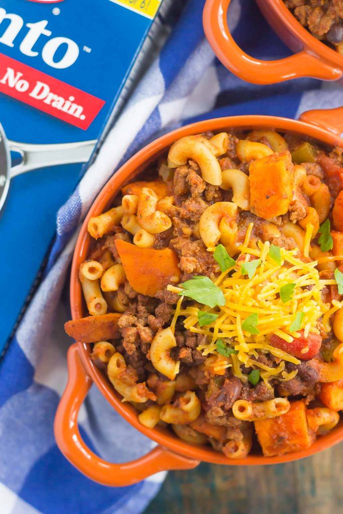 This Sweet Potato Chili Pasta is a one pot dish that's packed with the warm and comforting flavors of the season. Hearty, thick, and filled with sweet potatoes, beef, black beans, and pasta, you'll love this easy meal! #chili #chilipasta #chilirecipe #sweetpotatorecipe #sweetpotatopasta #sweetpotatochili #sweetpotatochilirecipe #dinner #falldinner #comfortfood #pasta #pastarecipe