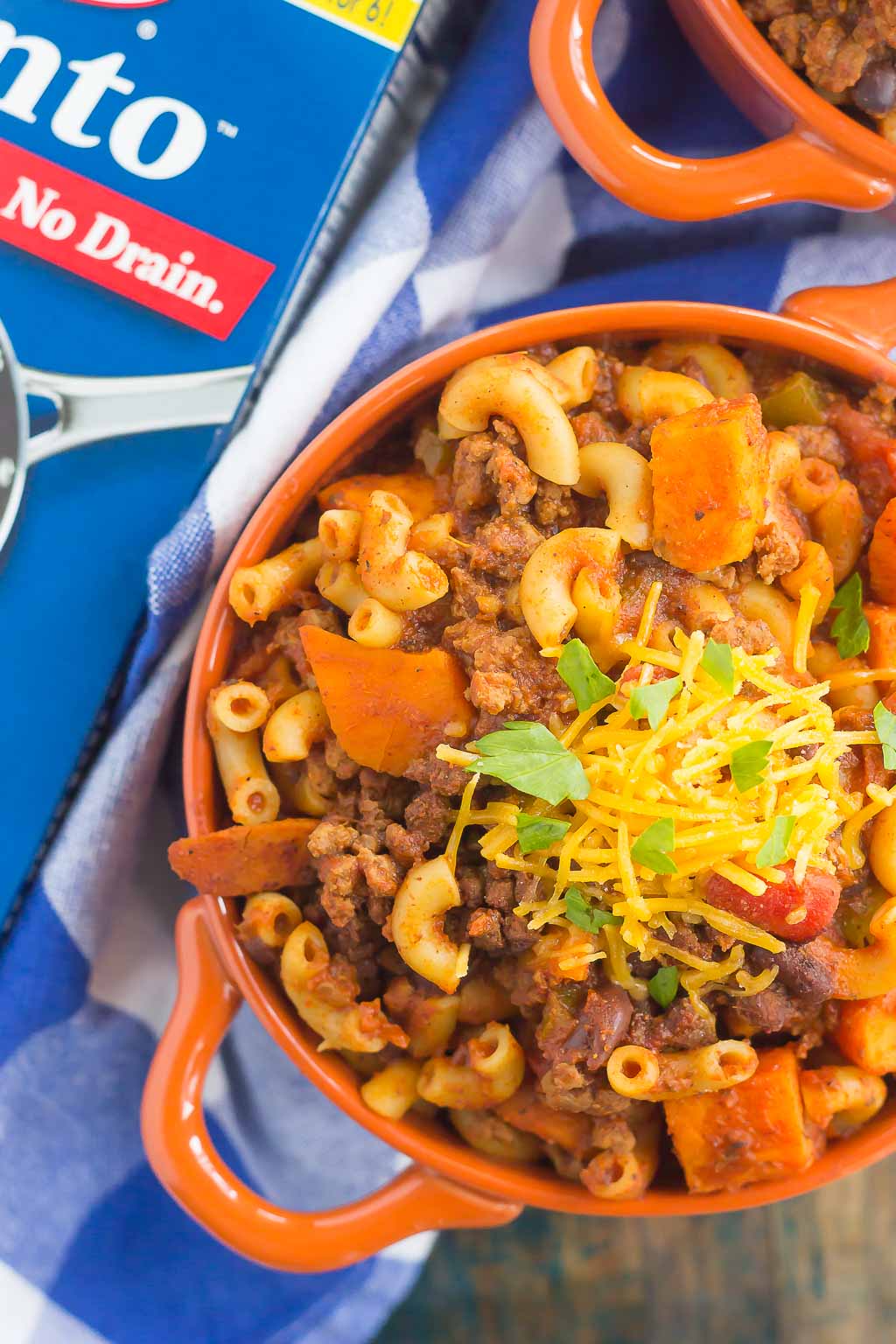 This Sweet Potato Chili Pasta is a one pot dish that's packed with the warm and comforting flavors of the season. Hearty, thick, and filled with sweet potatoes, beef, black beans, and pasta, you'll love this easy meal! #chili #chilipasta #chilirecipe #sweetpotatorecipe #sweetpotatopasta #sweetpotatochili #sweetpotatochilirecipe #dinner #falldinner #comfortfood #pasta #pastarecipe