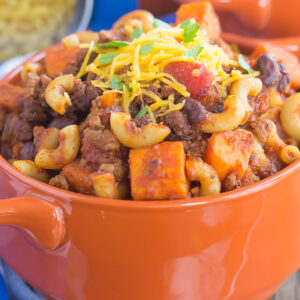 This Sweet Potato Chili Pasta is a one pot dish that's packed with the warm and comforting flavors of the season. Hearty, thick, and filled with sweet potatoes, beef, black beans, and pasta, you'll love this easy meal!
