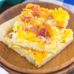 If you're looking for a new way to eat eggs and bacon, then this is it! This Bacon and Egg Breakfast pizza is filled with scrambled eggs, two kinds of cheese, and bacon, all sprinkled on top of a crisp crust. With just a few ingredients and minimal prep time, this breakfast pizza will be a meal time winner for breakfast, lunch, or even dinner!