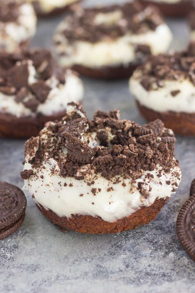 These Baked Oreo Donuts feature a rich, chocolate donut, studded with Oreo cookies and baked to perfection. Topped with a sweet cream cheese glaze and sprinkled with crumbled cookies, these donuts make the best breakfast or dessert!