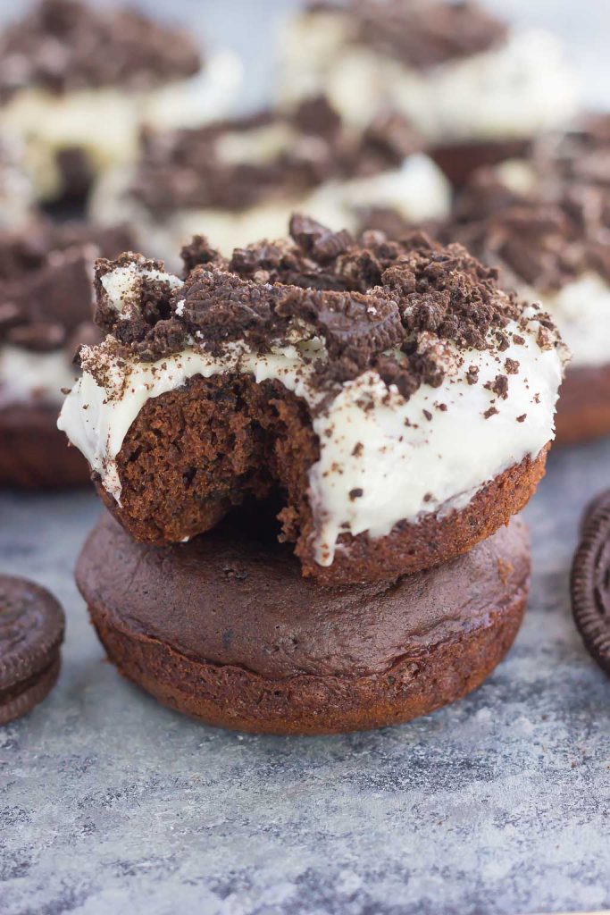 These Baked Oreo Donuts feature a rich, chocolate donut, studded with Oreo cookies and baked to perfection. Topped with a sweet cream cheese glaze and sprinkled with crumbled cookies, these donuts make the best breakfast or dessert!