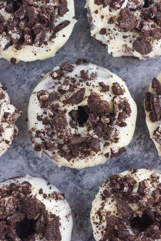 These Baked Oreo Donuts feature a rich, chocolate donut, studded with Oreo cookies and baked to perfection. Topped with a sweet cream cheese glaze and sprinkled with crumbled cookies, these donuts make the best breakfast or dessert!