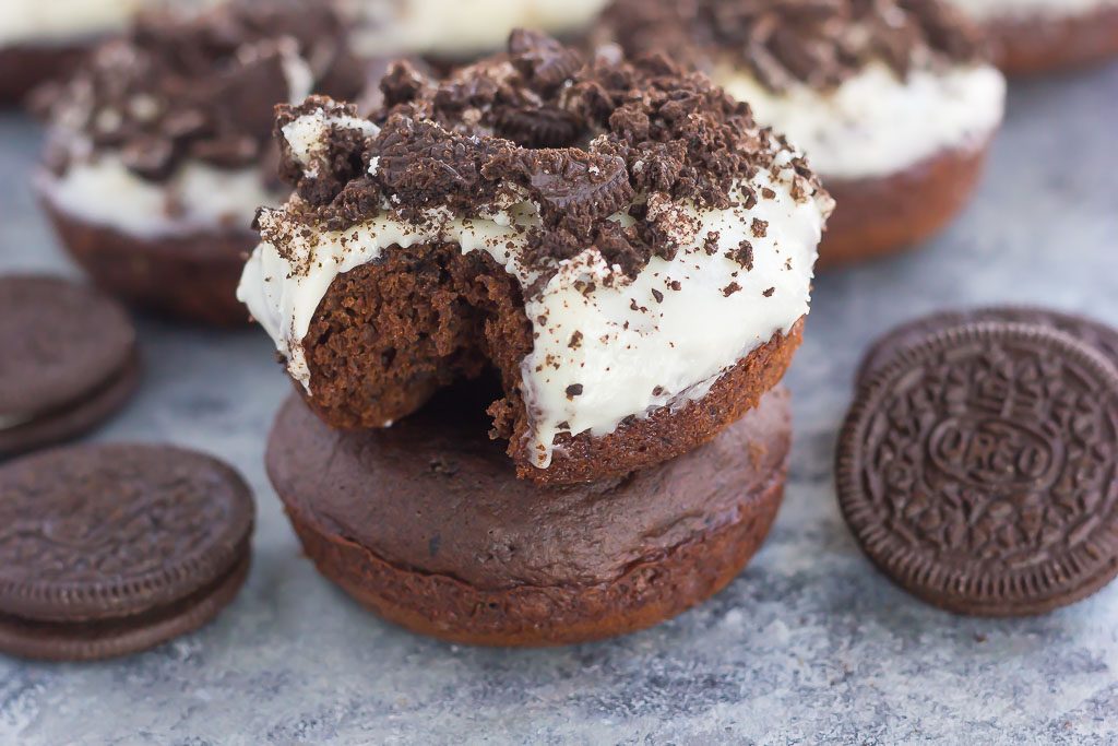 These Baked Oreo Donuts feature a rich, chocolate donut, studded with Oreo cookies and baked to perfection. Topped with a sweet cream cheese glaze and sprinkled with crumbled cookies, these donuts make the best breakfast or dessert!