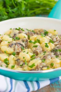 zoomed in shot of bowl of gnocchi with mushroom sauce 