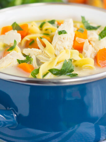This Slow Cooker Lightened Up Creamy Chicken Noodle Soup is loaded with chicken, fresh vegetables, and tender noodles, all tossed in a creamy broth. Warm, comforting, and lightened up, you can feel good about indulging in the classic soup, with a creamy twist!