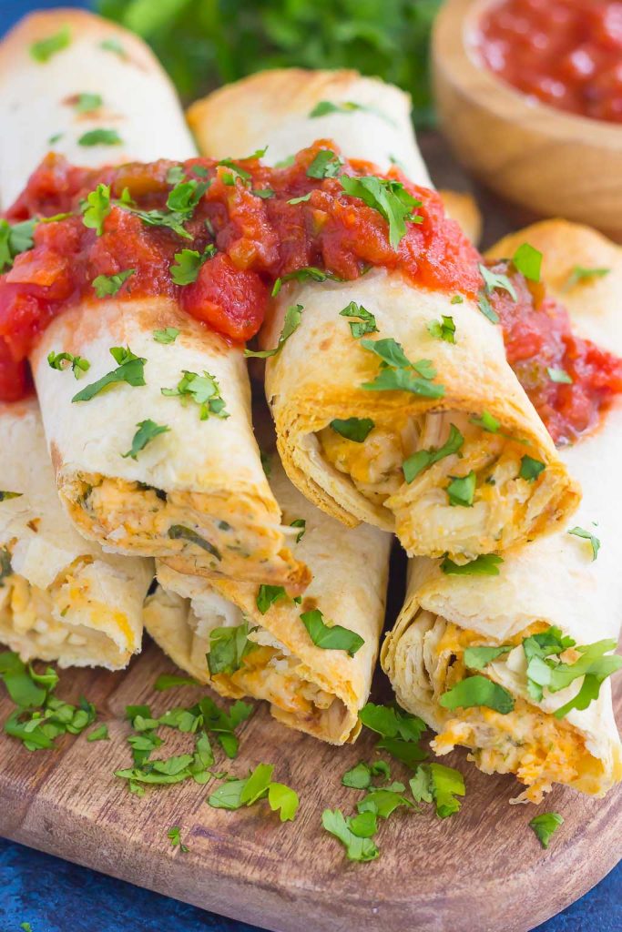 These Baked Chicken Ranch Taquitos are loaded with shredded chicken, cheddar cheese, cilantro, and a savory ranch cream cheese mixture. Fast, easy, and ready in less than 30 minutes, this simple dish is packed with flavor and perfect for the whole family!